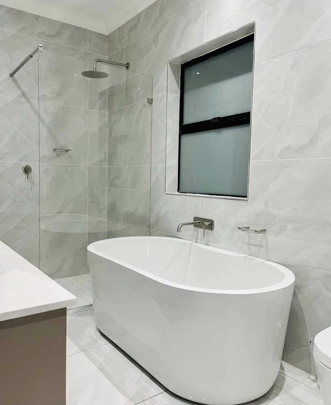 Spa-like bathroom with freestanding tub and glass shower