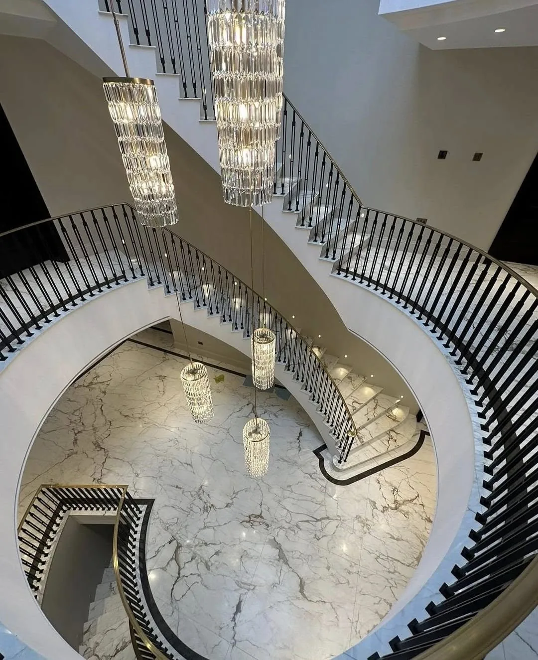 Curved custom staircase with iron railings