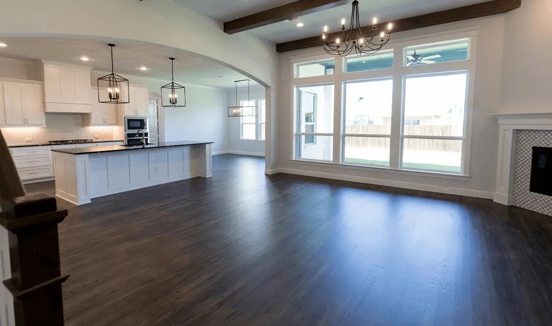 Open-concept interior with new flooring and large windows